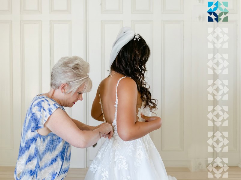 two women getting ready for a wedding