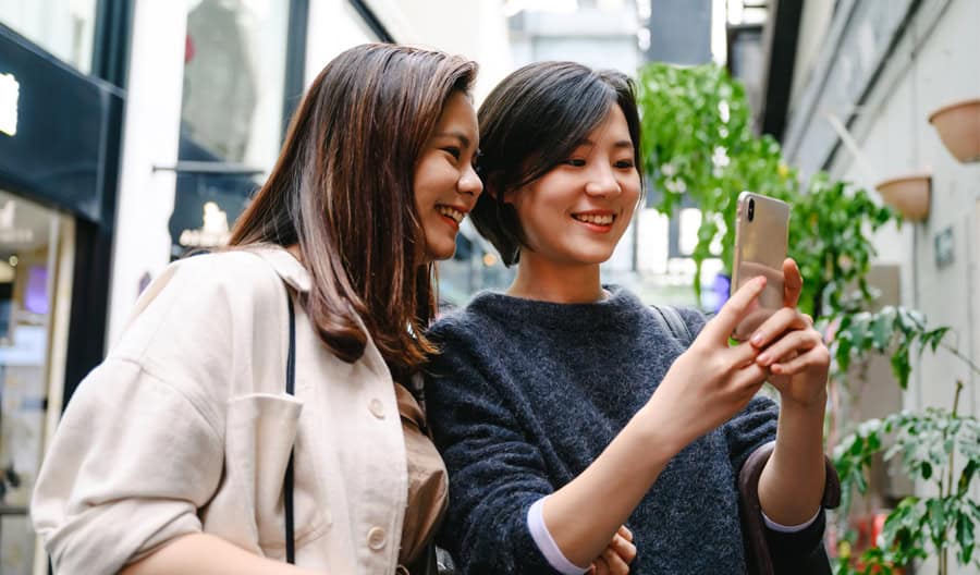 two people looking at phone