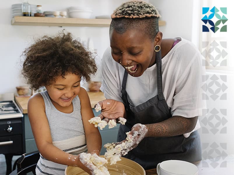 parent and child baking in kitchen